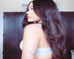 She has a small butterfly tattoo on her arm.